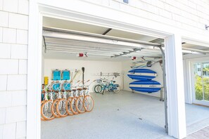 Garage with 8 bikes, paddle boards, beach chairs, coolers, beach toys, and 6-seater golf cart!