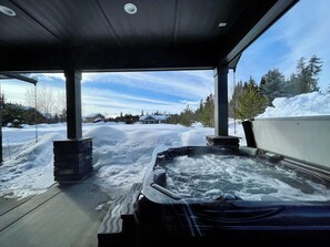 Covered patio with hot tub