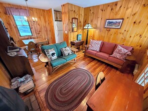 While a small cabin, the home feels spacious and cozy, and has that rustic mountain feel that will make you feel like you're a world apart from home