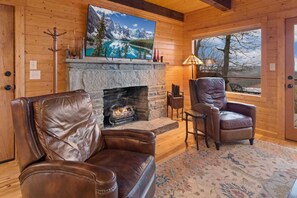 Leather Club Chairs, Stacked Stone Gas Fireplace, and Big Screen TV
