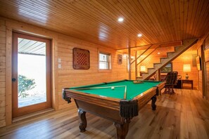 Lower Level Game Room has a Pool Table, Arcade Game, and a Queen Sleeper Sofa