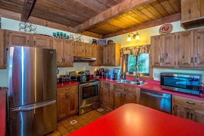 Fully equipped kitchen with everything you need for a great family meal, plus coffee and tea to start your day. Enjoy cooking indoors or fire up the grill on the back deck while taking in the views.