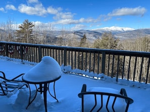 Expansive panoramic deck with unbeatable views of Mt. Washington and Black Mountain. Relax in comfortable seating, dine outdoors, and soak in the fresh mountain air in this stunning retreat.