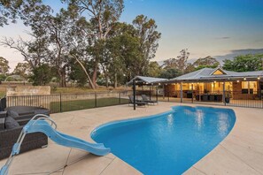 Swimming pool surrounded by nature.