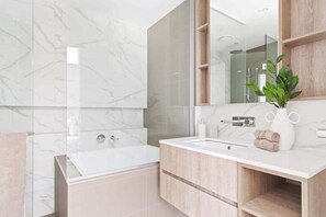 A warm & cozy bathroom with a Japanese bathtub.