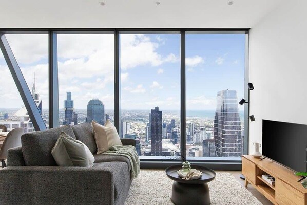 A spacious living area with a 3-seater sofa bed.