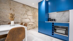 Our modern kitchenette counts with all the essentials you might need during your stay, like a stove, an oven, Nespresso coffee machine and dishwasher #practical #bright