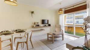 Bright living area with a TV and sofa-bed for 2 #bright #cozy