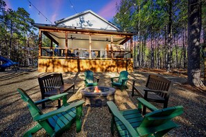 Overhead string lights in the backyard add to the ambiance
