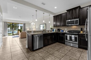 Open floorplan downstairs overlooking the water. 