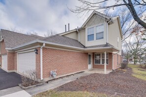Townhome Exterior | Garage Parking | Charcoal Grill