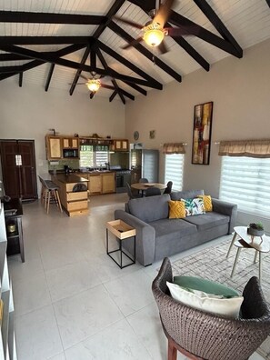 Fully equipped kitchen and spacious, tropical themed living/sitting area