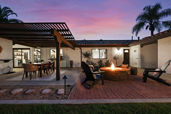 Peaceful courtyard with fire pit and BBQ grill. Please note: the main house is NOT part of your rental.