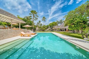 Private pool surrounded by spacious garden