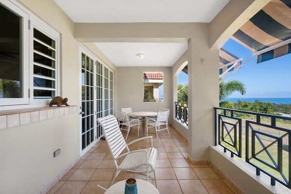 The oceanfront balcony off the living area is the best spot to unwind after a long day exploring the island!