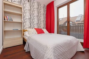 bedroom 1 with bookshelf
