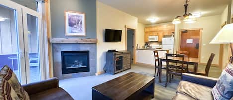 Open living room with gas fireplace.