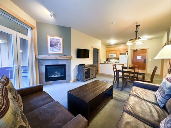 Open living room with gas fireplace.