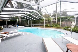 Bright, Blue Pool Fully Enclosed w/ Comfy Sun Loungers & Tropical Plant Life