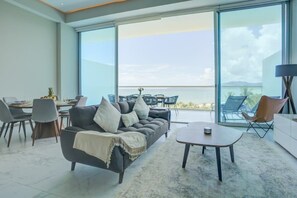 Floor-to-ceiling glass doors that open up to the terrace