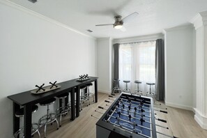 Game room. Foosball, electronic darts, scrabble pro, card tables and stools.