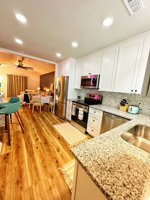 Full kitchen with cabinets to the ceiling