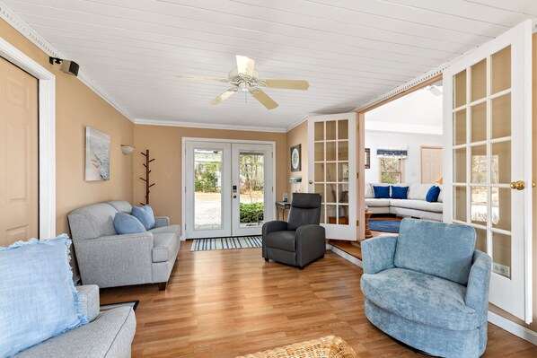 A charming sitting room welcomes you into the home 