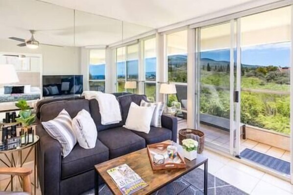 Relax in our bright, cozy living room with stunning views at 'The Maui Banyan' resort.