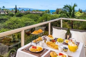 Dine al fresco with breathtaking views at 'The Maui Banyan' resort, perfect for a relaxing meal.