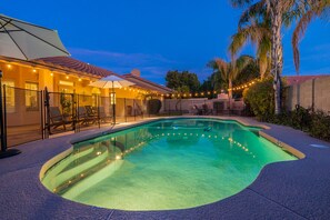 Heated outdoor pool fully fenced with a pool gate for kids safety purposes. 