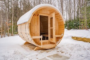 Inviting warmth emanates from the brand new barrel sauna! 