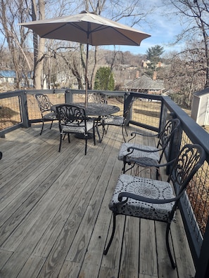 DECK with VIEW OF ASHEVILLE beyond the LARGE BACK YARD