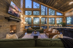 Plenty of seating for the whole family in the living room - enjoy floor to ceiling windows to immerse yourself in nature