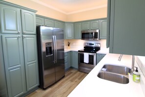 Modern, remodeled kitchen with brand new appliances and stove top