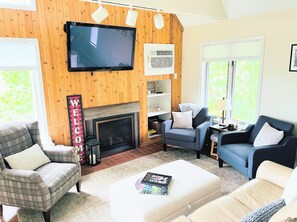 Main living room w/ gas fireplace and Roku TV.