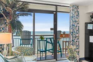 Enjoy your leisure time on your vacation even when you are in your room. This living room with oceanfront balcony is your perfect spot for relaxing and making your vacation go right. Dine, watch movies, play games, cook, or just hang out right here.