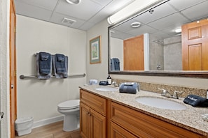 This full bathroom is the ideal place to begin and end your beach vacation day. Newly remodeled tile shower, double vanity, and toilet. All the essentials with towels provided.