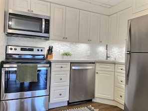 Newly renovated and fully stocked kitchen.