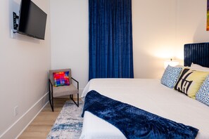 Bedroom 4- King Bed, extra seating, wall mounted HDTV w/ streaming services
