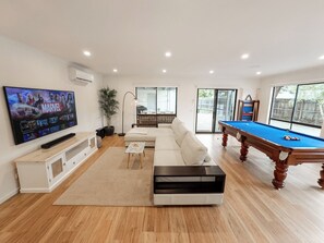 Ultimate entertainment room, featuring slate pool table and large 75" TV with Sonos home theatre