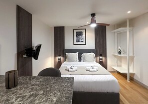Enjoy a restful night's sleep in this chic bedroom with a queen-size bed