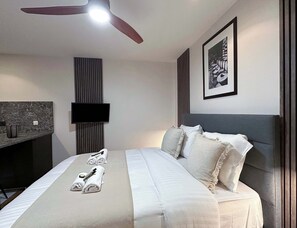 Enjoy movie nights in the cozy living room with a flat-screen TV