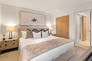 Primary bedroom with king size bed featuring en-suite full bathroom