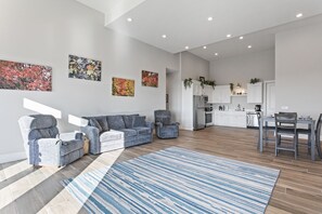 Massive family room with recliner couches and love seats, 20' ceilings