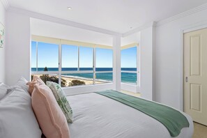 The primary bedroom is an oversized retreat and boasts spectacular views, a queen-sized bed and a sumptuous ensuite bathroom.
