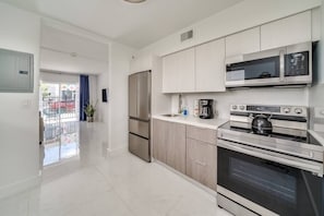 Enjoy a full kitchen nicely equipped with cooking essentials