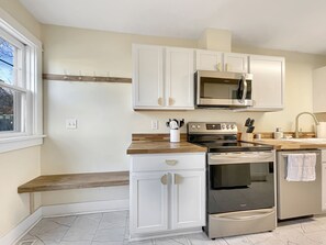 Beautiful kitchen with a welcome area to hang coats and leave shoes