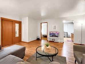 Living Room with smart TV, with entrances to Master bed and kitchen