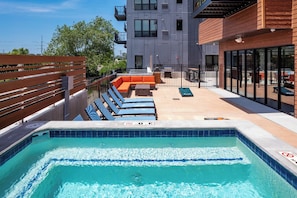 Shared hot tub that is ideal for relaxing after a long day, socializing with friends, or enjoying a quiet moment under the stars.