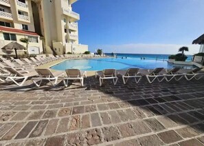 Lounge by the poolside while admiring the ocean views embracing the paradise.